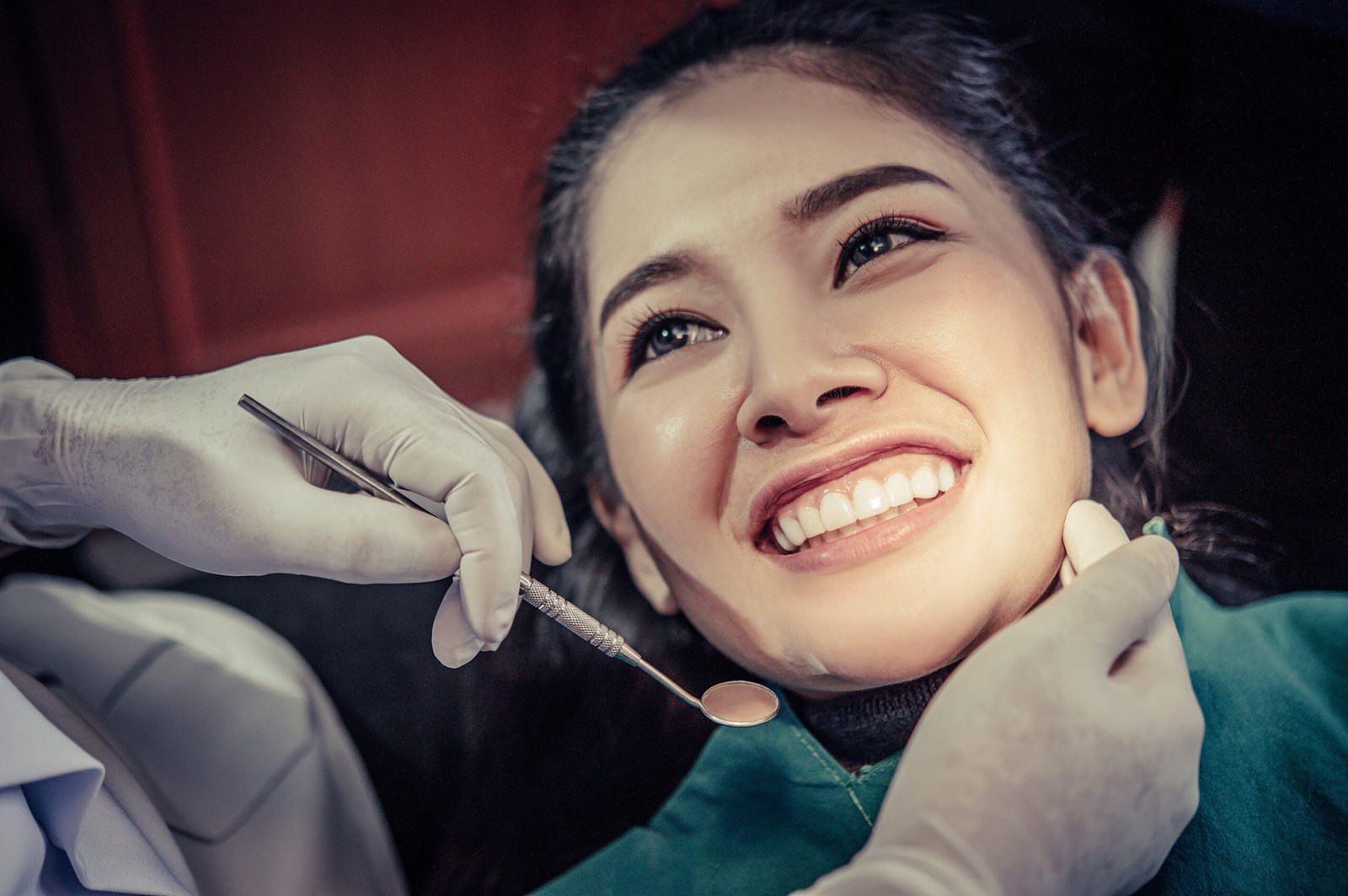 Dentist examining patient's teeth